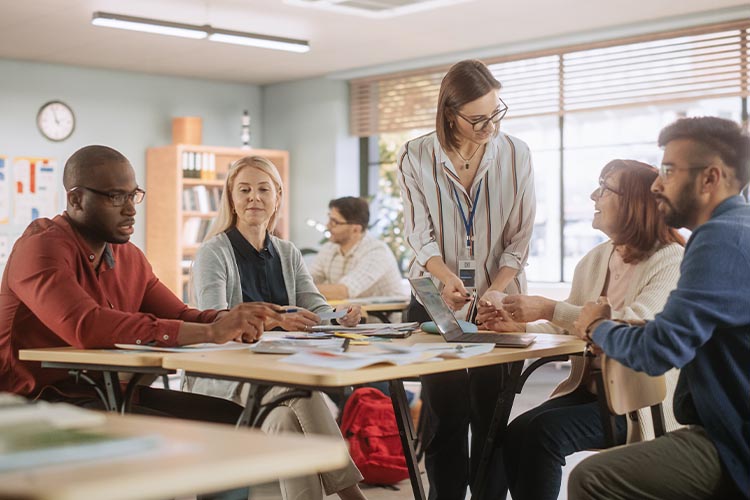 

  
      Female teacher in a classroom with older adults
  
